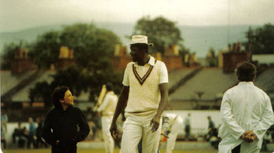 Joel Garner talks to a youngster at Rathmines in 1984