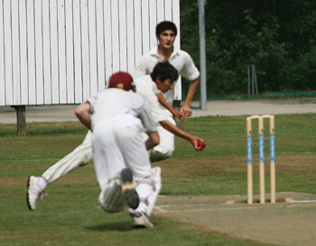Scotland's Chris Hunt is run out by Ali Shah of Denmark