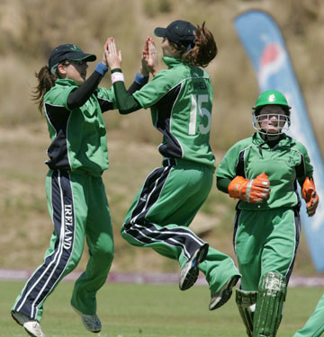 The Irish players celebrate the fall of a Scottish wicket (Photo: ICC)