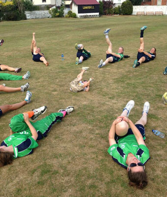 Oliver Molins leads the Irish women through their warm-up session